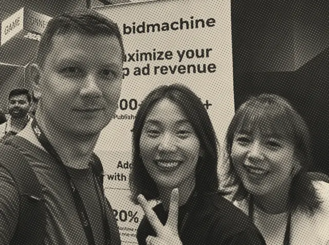 Ilia with a booth team at a games conference